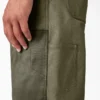 Salopette à double plastron en toile cirée
